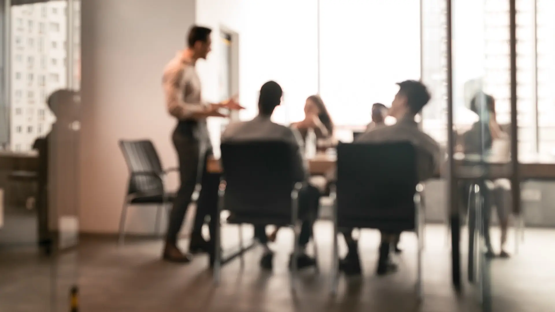 A Catalyst team collaborating around a boardroom table