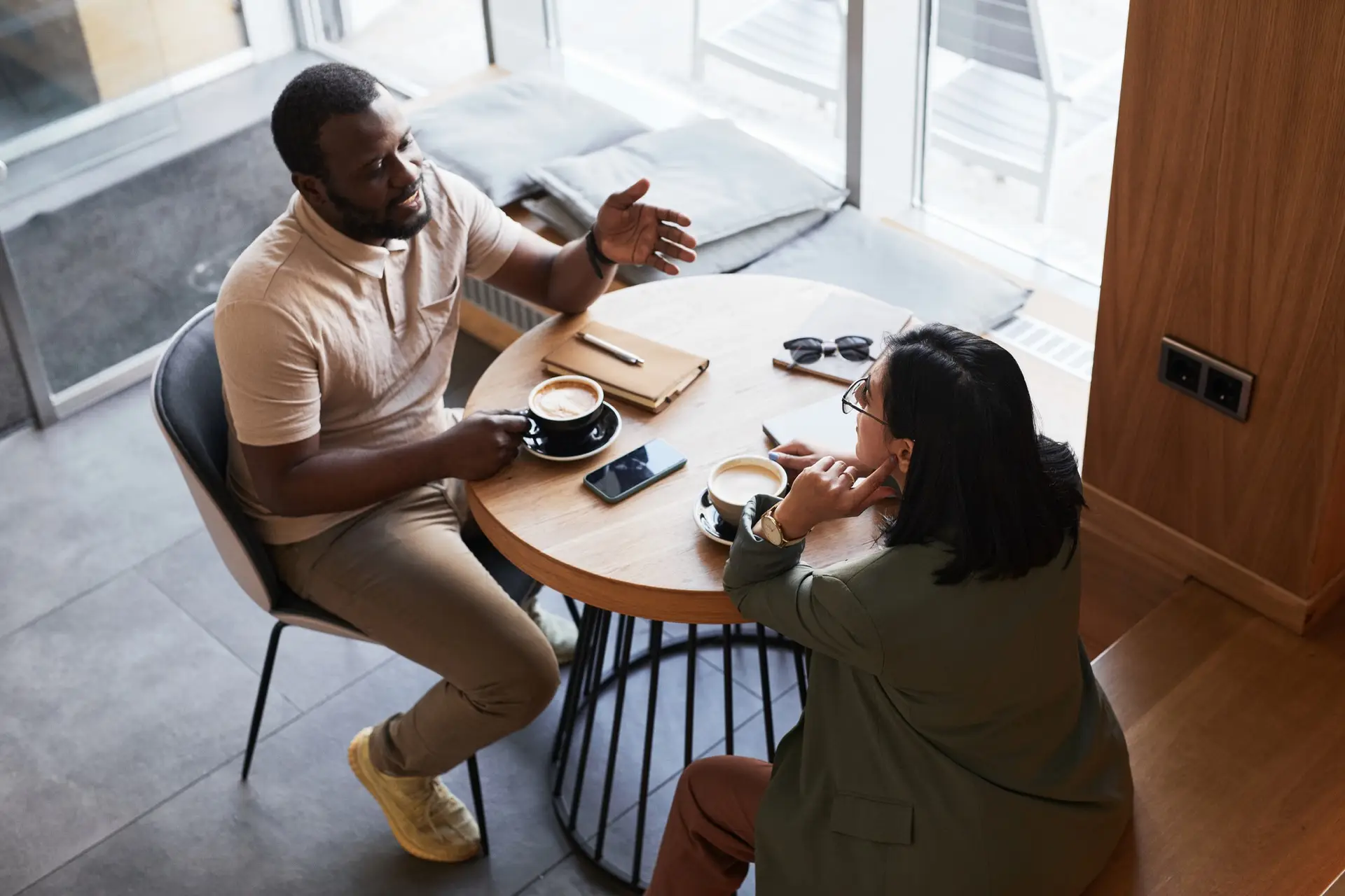 Two Catalyst team members collaborating over coffee